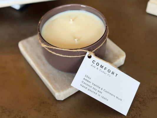 Double wick Comfort candle in amber vanilla & cashmere musk. 10oz coconut soy wax candle, hand-poured in Idaho for a warm, cozy glow.
